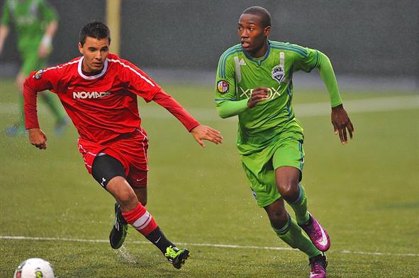 Decatur High School senior Dom Dismuke (right) signed with the University of Washington recently to play soccer. Dismuke also plays for the Sounders FC Under-18 Academy Team.