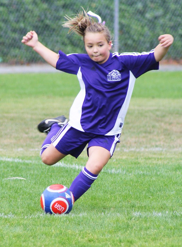 Federal Way Reign White '01 player Shayna Snodgrass takes a kick during the first weekend of the annual Blast Off soccer tournaments