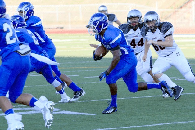 Junior Chris Williams returns the opening kickoff