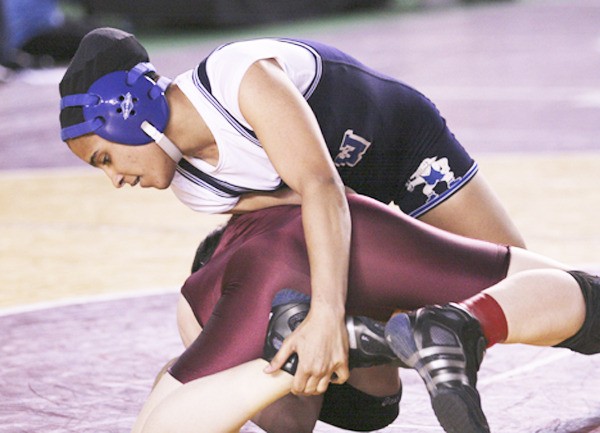 Federal Way High School senior Maria Manzueta finished in fourth place at last year’s state tournament and is one of 13 girls on the Eagles’ roster. She is wrestling at 119 pounds.