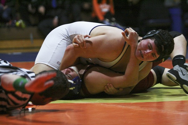 Decatur senior heavyweight Kyle Gleed earns a pin against an Enumclaw opponent Thursday night during the SPSL 3A showdown in Federal Way. Enumclaw won the match