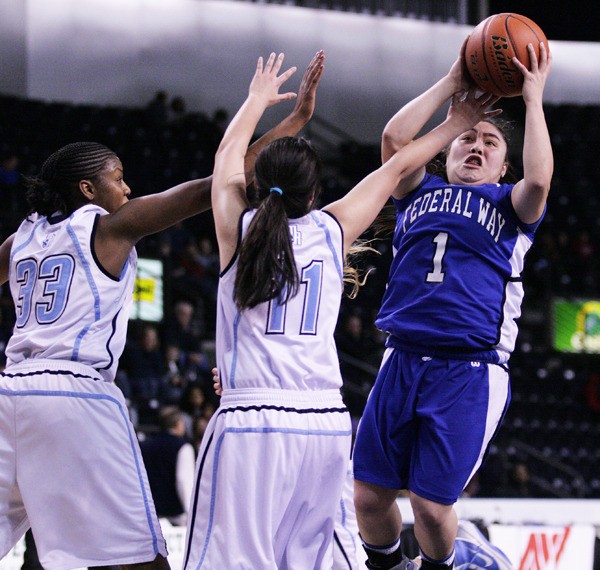 Federal Way junior Darah Huertas-Vining goes up for a shot during the Eagles' 66-56 win over Mount Rainier Monday to claim the West Central/Southwest District Tournament championship. Federal Way faces Bellarmine Prep in the first round of the Class 4A State Girls Basketball Tournament Friday at Rogers High School.