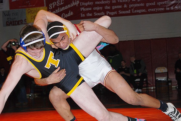 Thomas Jefferson 195-pounder K.W. Williams (right) takes control during his match against Tahoma's Matt Hopkins during the championship match at the Region II Tournament at TJ Saturday. Williams won the title and advances to the Mat Classic.