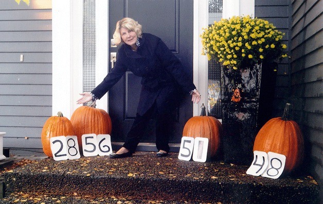 Federal Way resident Dani Clement with her four pumpkins from a few years back.