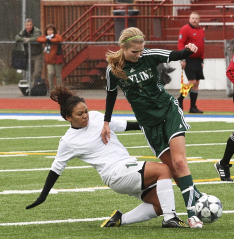 Beamer junior Tiarra Fentress (left) attempts to take the ball from a Skyline player during Saturday’s 1-0 loss at Federal Way Memorial Stadium in a Class 4A state quarterfinal game.