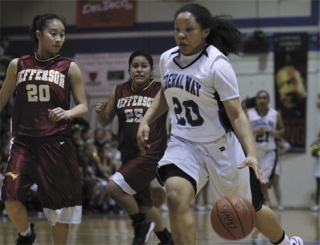 Federal Way sophomore guard Brittany Barrington dribbles up the court against Jefferson's Samantha Pham Wednesday night during the Eagles' 80-30 win in the opening round of the West Central District Tournament. Barrington scored a game-high 21 points.