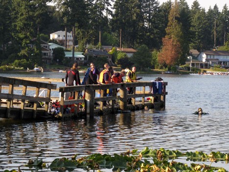 Rescue crews search Steel Lake on July 28.