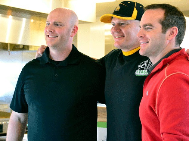 Stacks owners Emmett Brost and Sebastian Brost presented ex-Seahawk quarterback Jon Kitna with his official burger architect certificate on Saturday after designing the original 'TD - Burger.'