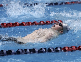 Beamer High School junior Shane Clare swims the backstroke portion of the 200-yard individual medley during the Class 4A State Swimming and Diving Championships inside the King County Aquatic Center. Clare finished third in the race.