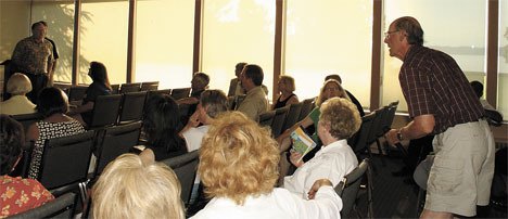 Federal Way resident Peter Townsend speaks at a July 27 public meeting regarding the future of Dumas Bay Centre. The meeting was held in a banquet room