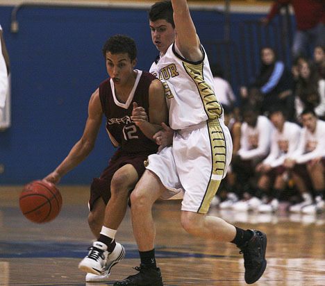 Jefferson senior point guard Scott Sanford dribbles around Decatur senior Robert Oliver during the Raiders' 54-53 win over the Gators at the Bill Riley Communities Holiday Classic at Decatur High School on Dec. 29.