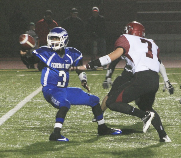 Federal Way quarterback D’Londo Tucker pitches the ball during the Eagles’ 21-11 loss to Eastlake in the opening round of the Class 4A State Football Playoffs on Saturday in Federal Way.