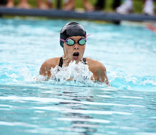 Marine Hills swimmer Breanna Ross swims the breaststroke during the All-City Meet Tuesday at the Arbor Heights Swim and Tennis Club. Marine Hills won the title for the second year in a row and Ross won in the Girls 9-10 butterfly.