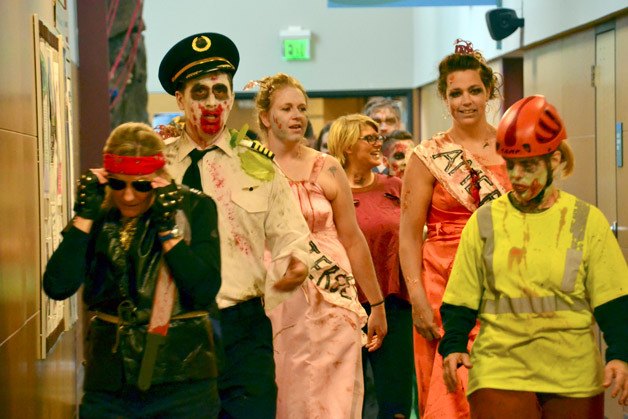 Residents dressed as zombies participate in the annual Freaky 5k Zombie Run in Federal Way on Oct. 17.