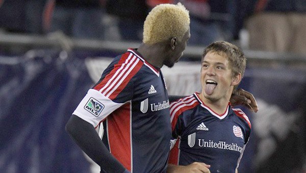 Federal Way High School graduate Kelyn Rowe celebrates a goal with New England Revolution teammate Saer Sene during a 2-0 win over the Chicago Fire on Saturday.