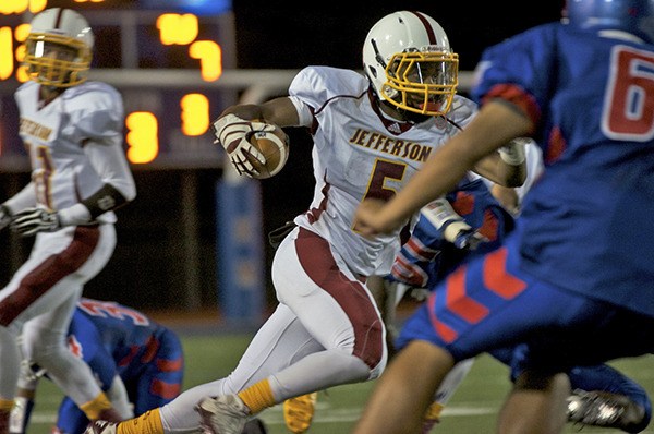 Thomas Jefferson senior Tyrell Williams runs the ball during the Raiders 35-7 win over Kent-Meridian Thursday night in SPSL North action.