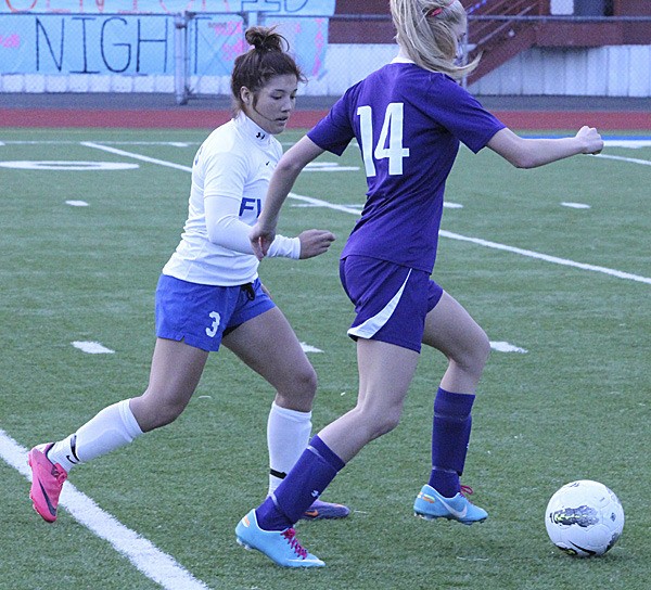 Federal Way senior Bianca Arizpe plays defense against a Puyallup player during Wednesday's 3-1 loss to the league-leading Vikings at Federal Way Memorial Stadium.