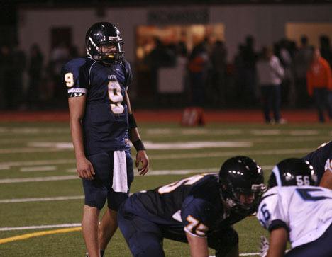 Decatur High School quarterback Alex Bykovskiy prepares to take a snap during the Gators’ homecoming loss to the Rogers Rams Friday night at Federal Way Memorial Stadium