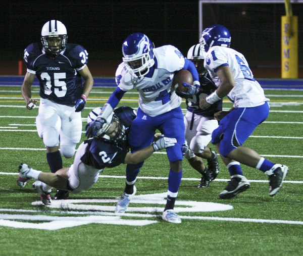 Federal Way sophomore wide receiver Mike Tate runs through a Beamer tackle during the Eagles' 40-35 win Friday at Federal Way Memorial Stadium. Tate caught two touchdown passes from Nick Tanielu during the win.