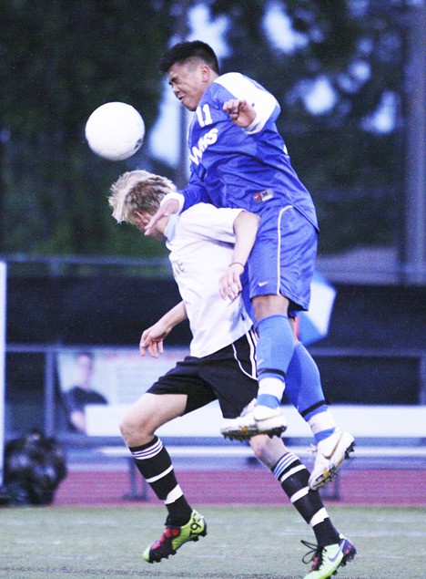 Federal Way's Sean Tang battles for the ball during the Eagles' 2-0 loss to Lake Stevens Friday night in the Class 4A state semifinals at Harry Lang Stadium in Lakewood. Federal Way finished in fourth place.