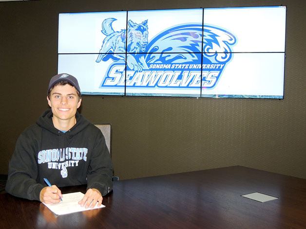 Spencer Clapp smiles as he signs his National Letter of Intent to play for the Sonoma State Seawolves on April 15.