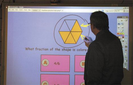 Adelaide Elementary School teacher Jake Booker credits classroom technology such as the ActiveBoard (shown above) for improving the performance of his entire second-grade class. All of his students are now meeting or exceeding grade-level expectations.