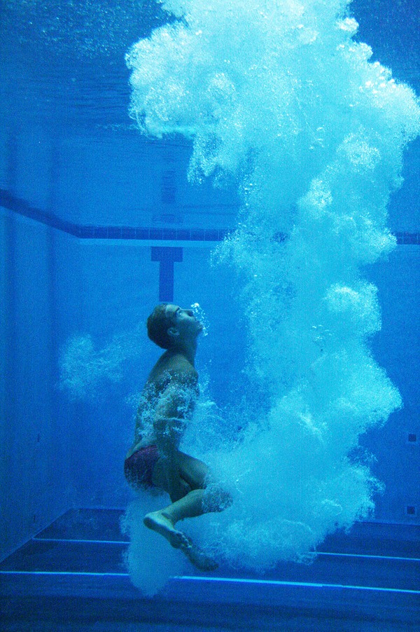 Olympic diving hopeful Kristian Ipsen swims back to the surface at the King County Aquatic Center during a practice session  promoting the 2012 United States Olympic Trials