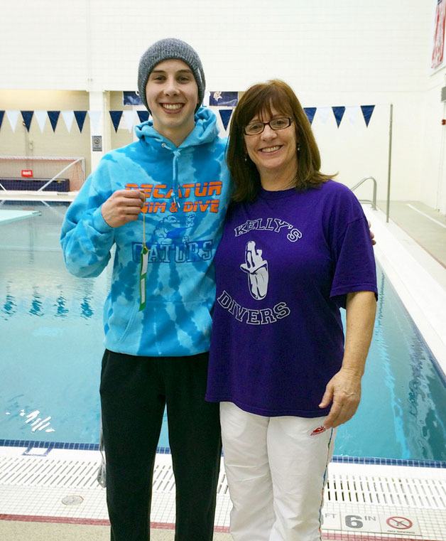 Decatur student Jordan Nelson with his swim coach Kelly Robertson. The senior diver placed ninth out of 24 competitors at the state championships last weekend.