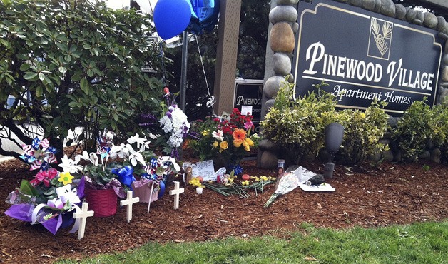 Makeshift memorials at Pinewood Village Apartments in Federal Way