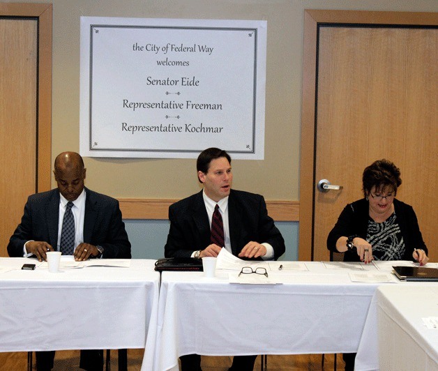 Mayor Jim Ferrell (center) speaks with local legislators during an event Monday