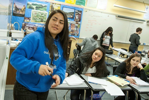 Federal Way High School student Andrea Scanlan gets some help with math in an AVID tutorial group with Azalea Finauga and Nadya Chernichenko.