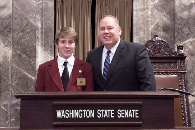 Decatur High School student Max Grim (left) spent a week working as a page for Brad Hendrickson