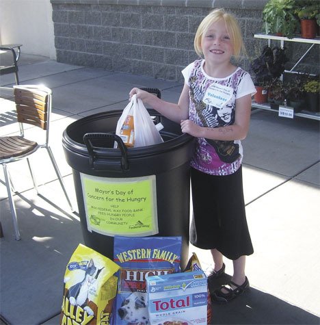 Jhena Paterno volunteers with the Mayor's Day of Concern food drive. She is just one of over 1