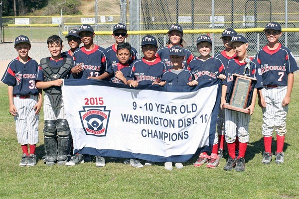 Federal Way National Little League 9/10 all-star baseball players pose with their District 10 championship banner after their 13-3 win over Auburn on June 20.  Team Roster:  R'Mani Adams