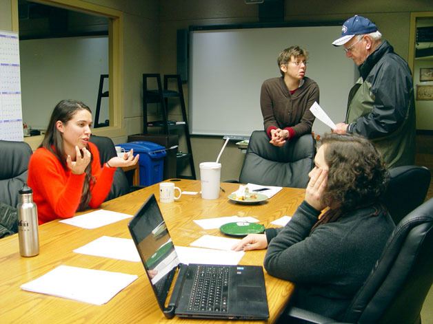 Rebecca Solverson (left front) of Tacoma speaks with Jennifer Boutell (right front) of Zero Waste Washington about the possibility of a tool library in Federal Way on Dec. 11. Boutell