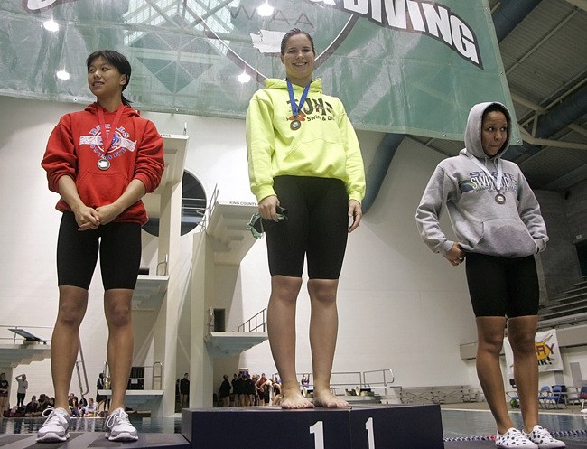 Thomas Jefferson High School junior Amber Cratsenberg stands atop the podium after winning the 100-yard freestyle in All-America time at the 2010 Class 4A State Swimming and Diving Championships at the King County Aquatics Center Saturday.