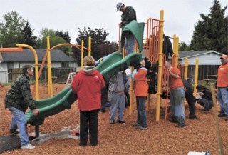 Volunteers built a playground at the Westway neighborhood May 14.