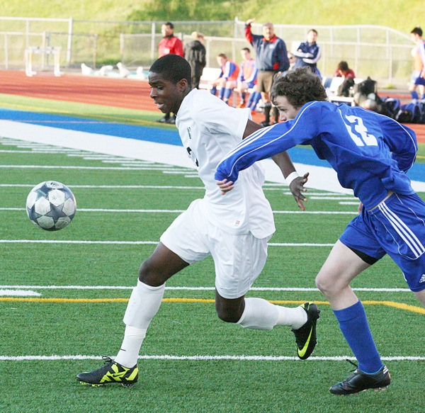 Todd Beamer senior forward Ugo Okoli goes after the ball during the Titans' 4-0 win over the Tahoma Bears in the opening round of the Class 4A State Boys Soccer Tournament Tuesday at Federal Way Memorial Stadium. Okoli is the Titans' leading scorer with 24 goals this season.