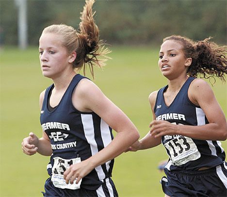 Todd Beamer’s Taylor Kartes (left) and Sara Mussa helped the Titans qualify for Saturday’s West Central District Cross Country Meet by finishing fifth as a team at the South Puget Sound League Championships Saturday at Fort Steilacoom Park. Beamer and Jefferson qualified both their boy and girl teams for the district meet.