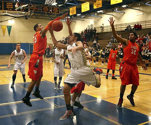 Decatur's Jason Young goes for a shot Jan. 18 against Lakes.