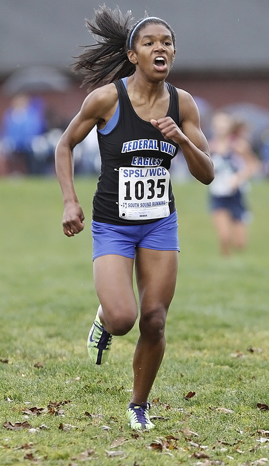 Federal Way's Jasmine Johnson cruises to the victory at the SPSL Sub-district Cross Country Meet Saturday at Fort Steilacoom Park in Spanaway. Johnson won the race by nearly 40 seconds.