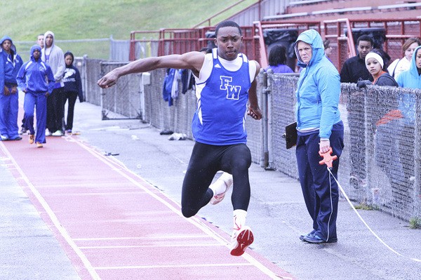 Federal Way junior D'Londo Tucker competes in the triple jump during Wednesday's 88-47 win over Beamer at Federal Way Memorial Stadium. Tucker finished second with a leap of 40-11.