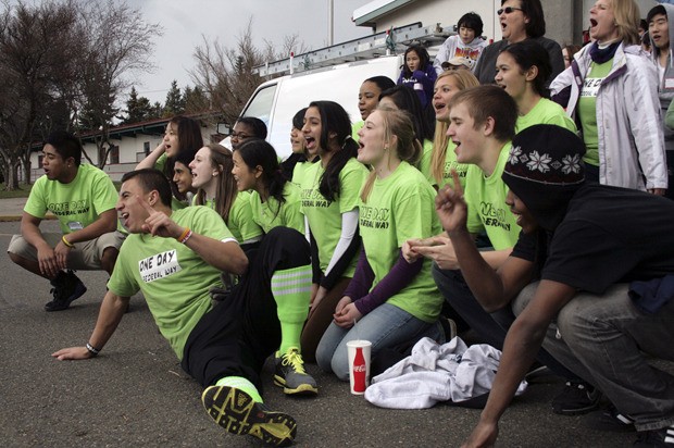 Volunteers cheer One Day Federal Way while taking a break Feb. 22 at Star Lake Elementary School.