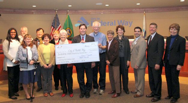 The Federal Way Coalition of the Performing Arts presented the city with a check for $613