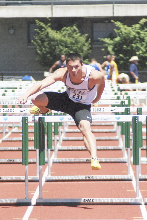 Federal Way Track Club hurdler Cory Okasaki runs the 110-hurdles at a recent meet. Okasaki will compete at the USATF Junior Olympic Track and Field National Championships in Sacramento