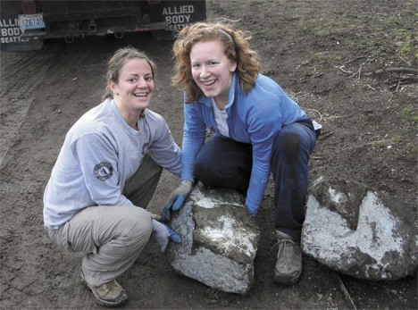 AmeriCorps members Sarah Swihart and Libby Miles participate in a Martin Luther King Jr. Day service project at Dumas Bay. AmeriCorps members and volunteers revamped a staircase leading from the facility to the Puget Sound. They also landscaped the grounds.