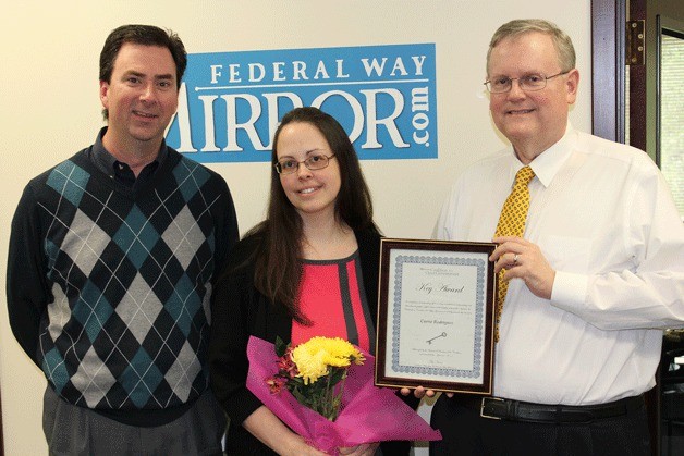 Washington Coalition for Open Government president Toby Nixon (right) presents a Key Award to Mirror editor Carrie Rodriguez (center) on April 24. Also pictured is publisher Rudi Alcott.