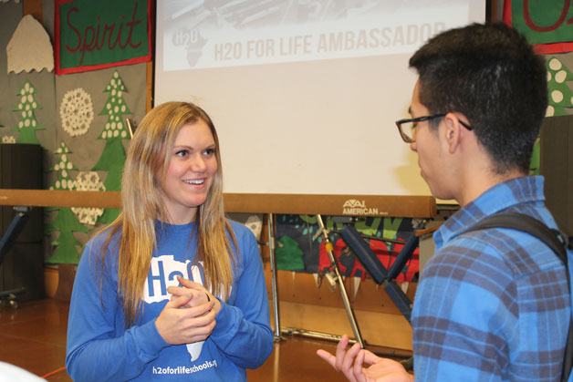 Katie Spotz speaks with a Todd Beamer High School student after her speech on Monday.