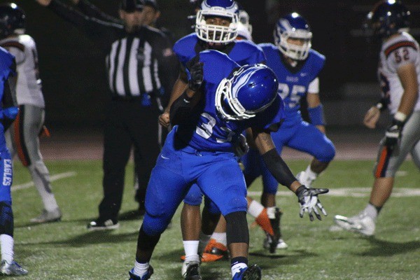 Federal Way's Marshun Newman celebrates after the Eagles recover a Decatur fumble during their 50-12 win on Friday