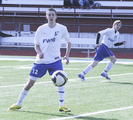 Federal Way High School senior Colby Lane (12) tallied the only goal for the Eagles during their 1-1 tie against Thomas Jefferson on Friday night. The Raiders' goal came from Sam Clement.